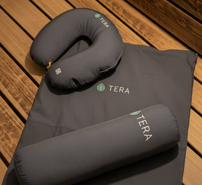 Sauna set Footrest_ pillow_ matress with 'TERA' branding on wooden surface.