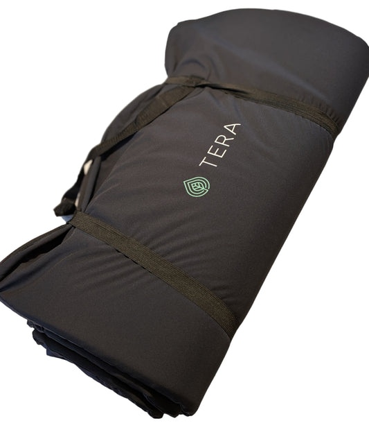 Folded black sauna matress with 'Tera' branding